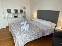 A bed or beds in a room at POLITEAMA SUITE IN THE HEART OF THE CITY