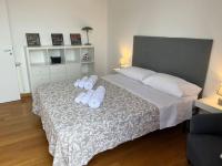 A bed or beds in a room at POLITEAMA SUITE IN THE HEART OF THE CITY