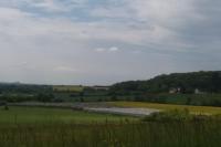 a river in the middle of a green field at meublé entier indépendant en contigu de ma maison in Saint-Georges-sur-Moulon