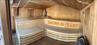 an inside of a sauna with a vase in it at Gite wellness Au champ du bouillon proche de Pairi Daiza et de la ville Ath 