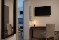 Televízia a/alebo spoločenská miestnosť v ubytovaní Hotel Oliva