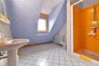 a bathroom with a sink and a toilet at S&#39;Harzala Jaune in Bergheim