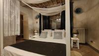 A bed or beds in a room at Podere Le Vedute