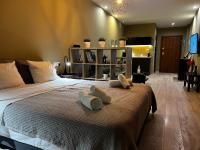 A bed or beds in a room at DISTRiCT 01-Luxury Urban Lofts