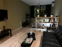 A television and/or entertainment centre at DISTRiCT 01-Luxury Urban Lofts