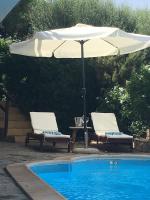 The swimming pool at or close to VILLA VITTORIA with PRIVATE HEATED SWIMMING POOL COMPLETE WITH HIDROMASSAGE FOR EXCLUSIVE USE , SEA VIEW, 150 METERS FROM THE BEACH
