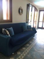 A seating area at VILLA VITTORIA with PRIVATE HEATED SWIMMING POOL COMPLETE WITH HIDROMASSAGE FOR EXCLUSIVE USE , SEA VIEW, 150 METERS FROM THE BEACH