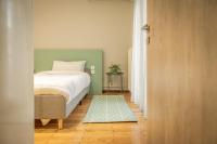 A bed or beds in a room at Hermes Apartment on Aristotelous Midas Home