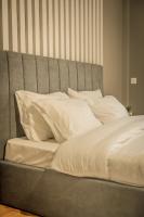 A bed or beds in a room at Hermes Apartment on Aristotelous Midas Home