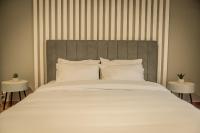 A bed or beds in a room at Hermes Apartment on Aristotelous Midas Home