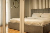 A bed or beds in a room at Hermes Apartment on Aristotelous Midas Home