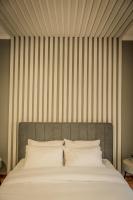 A bed or beds in a room at Hermes Apartment on Aristotelous Midas Home
