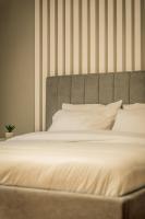 A bed or beds in a room at Hermes Apartment on Aristotelous Midas Home
