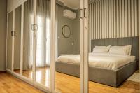 A bed or beds in a room at Hermes Apartment on Aristotelous Midas Home