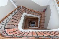 a spiral staircase in a building with a window at Studio inspiration hôtel standing Vieux-Port in Marseille