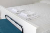 Łóżko lub łóżka w pokoju w obiekcie Apartamenty Zielona Lipka