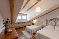 Postel nebo postele na pokoji v ubytování Vivienda Rural Las Bartolas