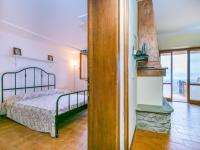 A bed or beds in a room at Apartment Bucaneve by Interhome