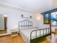 A bed or beds in a room at Apartment Bucaneve by Interhome