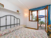 A bed or beds in a room at Apartment Bucaneve by Interhome