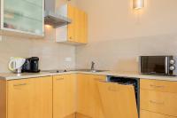 Kuchyňa alebo kuchynka v ubytovaní Rezydencja Spacerowa Apartamenty by Noclegi Renters
