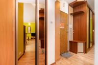 Televízia a/alebo spoločenská miestnosť v ubytovaní Rezydencja Spacerowa Apartamenty by Noclegi Renters