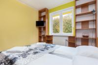 Posteľ alebo postele v izbe v ubytovaní Rezydencja Spacerowa Apartamenty by Noclegi Renters