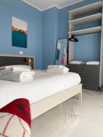 A bed or beds in a room at DIZETA Suite and Apartment