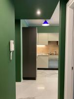 A kitchen or kitchenette at DIZETA Suite and Apartment