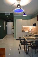 A kitchen or kitchenette at DIZETA Suite and Apartment