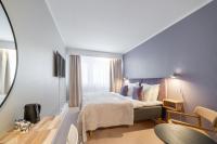 a hotel room with a bed and a window at Hotel Sparre in Porvoo