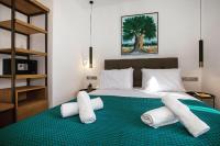 Posteľ alebo postele v izbe v ubytovaní Iconic Athens Suites
