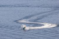 a person water skiing in a body of water at Home2Book Charming Duplex Tabaiba in Tabaiba
