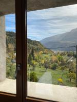 a window with a view of a mountain view at Appartement Le Lauzet in La Roche-de-Rame