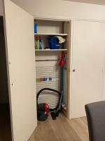 a room with a closet with a vacuum in it at Appartement Le Lauzet in La Roche-de-Rame