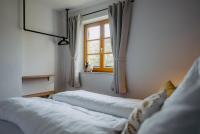 A bed or beds in a room at Kellerstöckl Huber in Eisenberg