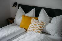 A bed or beds in a room at Kellerstöckl Huber in Eisenberg