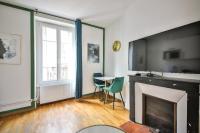 Televízia a/alebo spoločenská miestnosť v ubytovaní 21#Studio 2Pers#Sèvres-Lecourbe#Necker