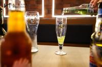 a bottle of champagne is being poured into two glasses at Hotel Initial-Taichung in Taichung