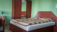 Posteľ alebo postele v izbe v ubytovaní Nefelejcs Apartman
