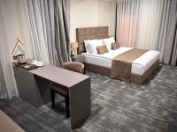 Postel nebo postele na pokoji v ubytování DARIC HOTELS