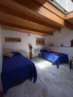Postel nebo postele na pokoji v ubytování La Perla della Cattedrale luxury home