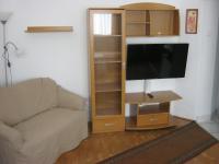 A television and/or entertainment centre at Kitti Apartman