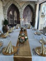 a long table in a room with a white table cloth at Regina Maria Spa Design Hotel in Balchik