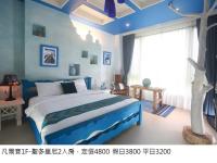 a bedroom with a large bed in a room at Jane Castle in Wujie