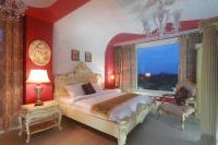 a bedroom with a large bed and a window at Jane Castle in Wujie
