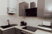 Kuchyň nebo kuchyňský kout v ubytování Modern stylish comfortable 2 bedroom apartment