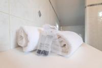 a pile of towels sitting on a bathroom counter at Pleasant apartment three minutes from the center of Annecy in Annecy