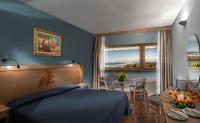 Posteľ alebo postele v izbe v ubytovaní Grand Hotel Continental