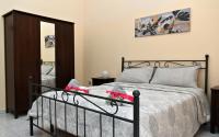 Posteľ alebo postele v izbe v ubytovaní B&B a Capua - I PORTICI del centro